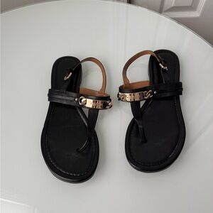 Black Strappy Sandals with Gold Tone hardware brand: Coach style: Caterine